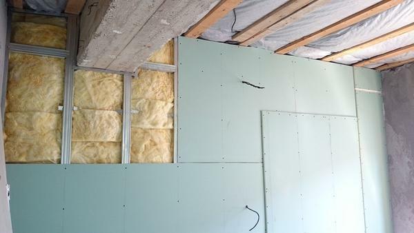 Aligning the walls with plasterboard, it is possible to additionally insulate them with mineral wool