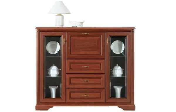 The chest of drawers for the dishes in the living room is an important part of the interior. It creates a special color due to the unity of the color scale