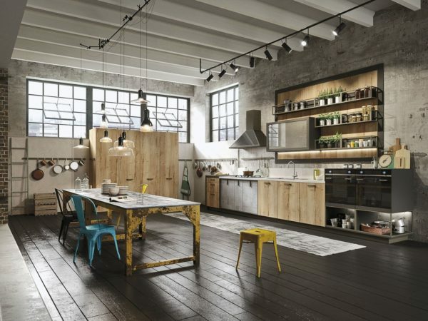 In order to most accurately convey the style loft, combine modern appliances and lighting with retro chairs and antique table