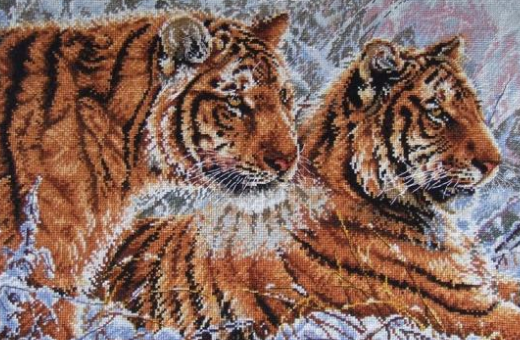 Tigre v obraze symbolizujú silu a moc