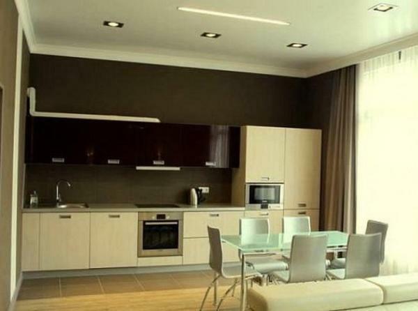 By combining the kitchen with the living room, you will get more space and a unique design