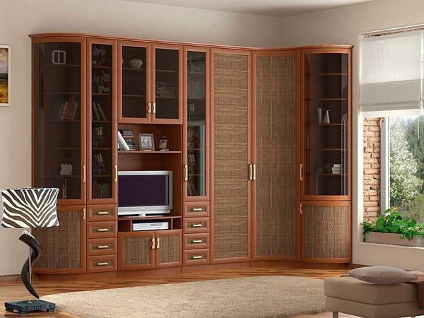 In order to slightly expand the room, you can choose a furniture wall with glass inserts