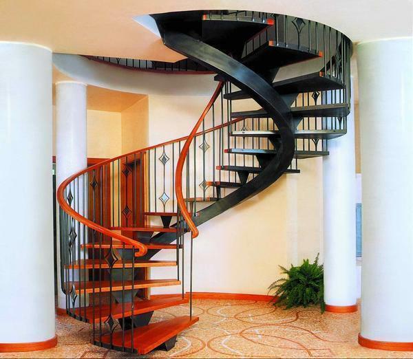 Beautiful and original in the interior of the guest room will look stylish spiral staircase