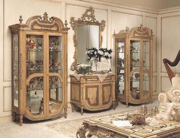 For a living room in the classical style, it is better to choose an expensive and high-quality showcase, in which you can place an elite service or exclusive figurines