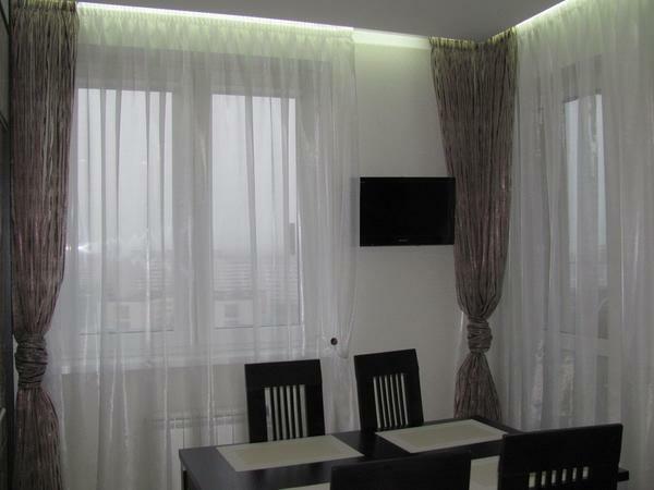With the help of long curtains you can make the kitchen more comfortable and cozy