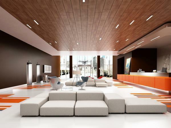 The original solution is the use of a wooden ceiling in combination with built-in lights