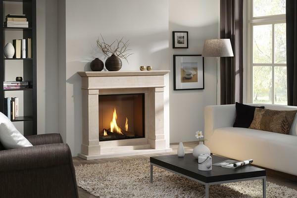 The fireplace in the living room looks good against the backdrop of the white walls, as all attention is focused on it