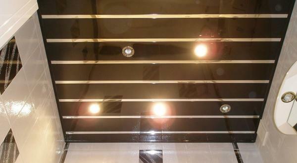 Spotlights - the most optimal lighting option for the rack ceiling