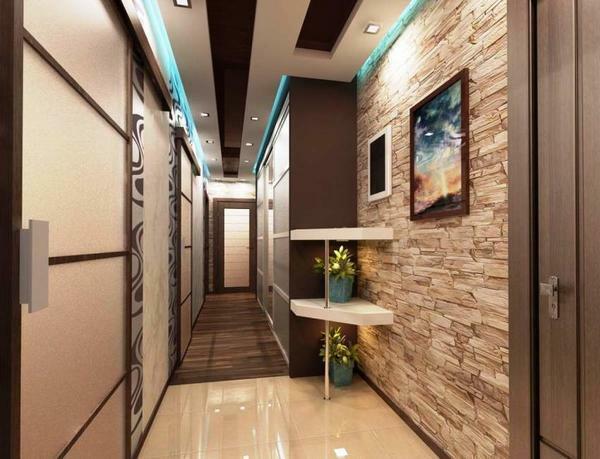 An excellent solution for the design of the corridor and hallway is a combined wall decoration or a combination of wallpaper of different colors