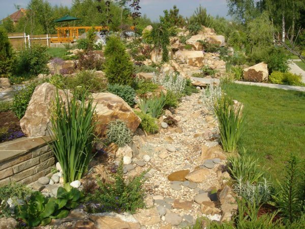 Make a dry creek sand and brown help limestone, granite or marble