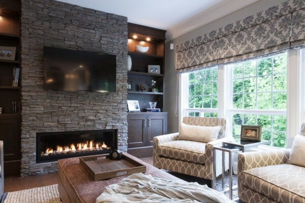 The cozy living room with a fireplace in a private home