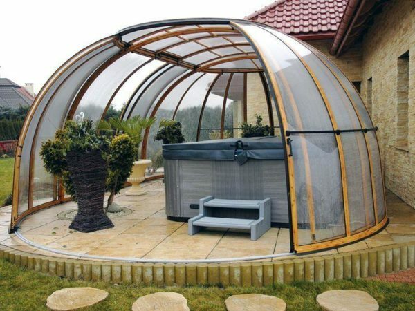 Domed gazebo with sliding dome sector instead of the door. Shape provides maximum resistance to wind and snow loads.