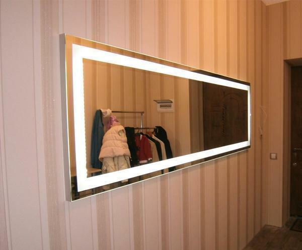 The backlight for a mirror can be implemented in several ways, for example, an LED strip or spotlights