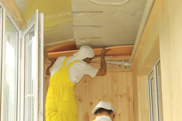 Installation of insulation to the ceiling.