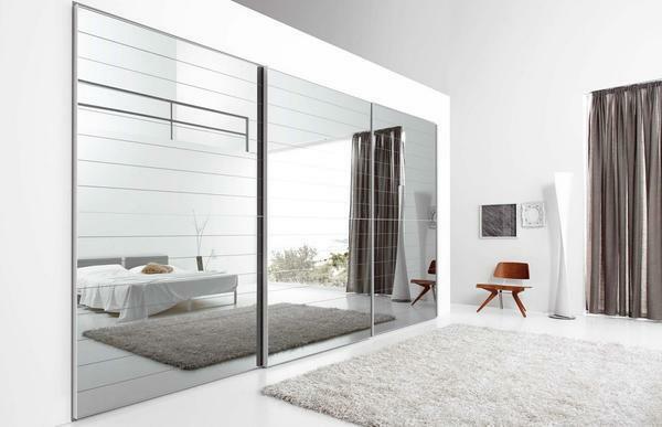 Mirror sliding doors look great in the interior, made in the style of high-tech