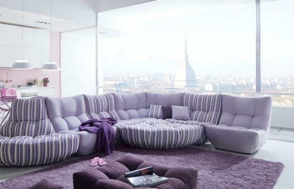 The living room, decorated in lilac color, will surprise visitors with an unusual design