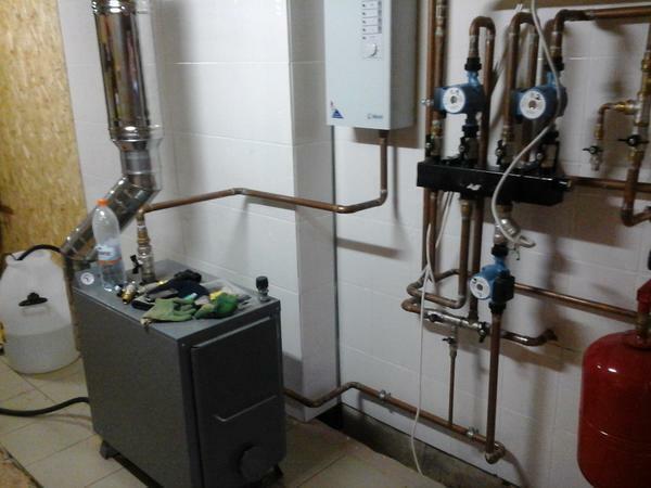 The basis of the scheme of water heating of a private house is a fuel unit - a boiler