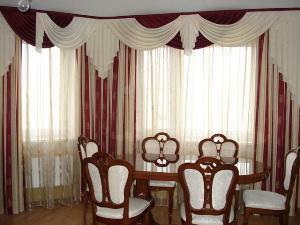 The color scheme blends curtains combined with chairs