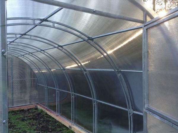As a rule, greenhouses of this type are installed on a concrete foundation or a beam
