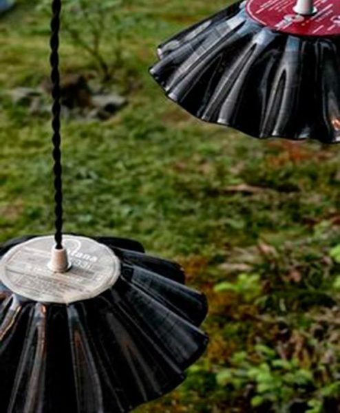Lampshades in the shape of a flower out of old vinyl records.