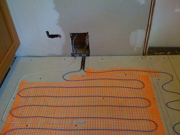Before laying the tiles on the cable floor it should be checked for damage