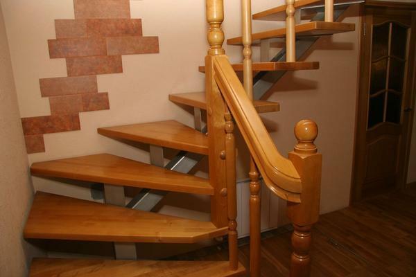An excellent solution is to use a metal frame in combination with a wooden staircase trim