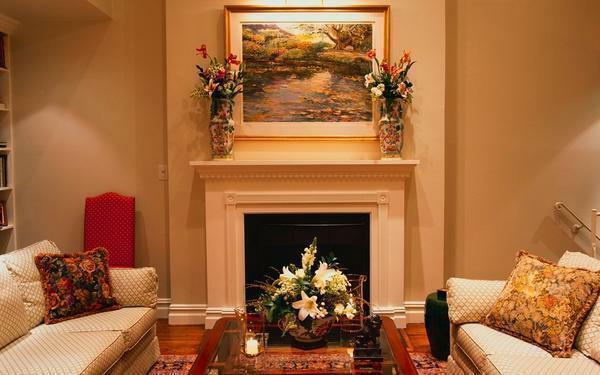 The fireplace should be made in the same style as the interior of the living room