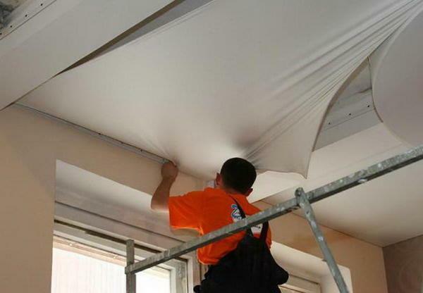 "Dry" method of leveling the ceiling involves the use of additional materials: stretch cloth, tiles, etc.