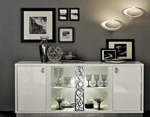 A chest of drawers with a glass for the living room brings a refreshing visual effect to the meager room coloring
