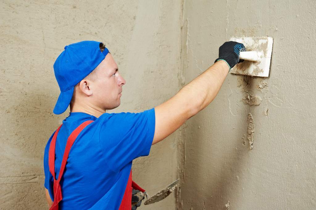 Plastering a brick wall