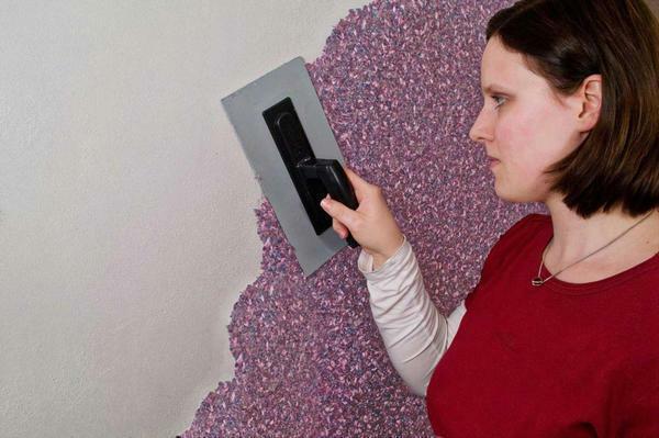 To apply liquid wallpaper use a wide spatula or trowel