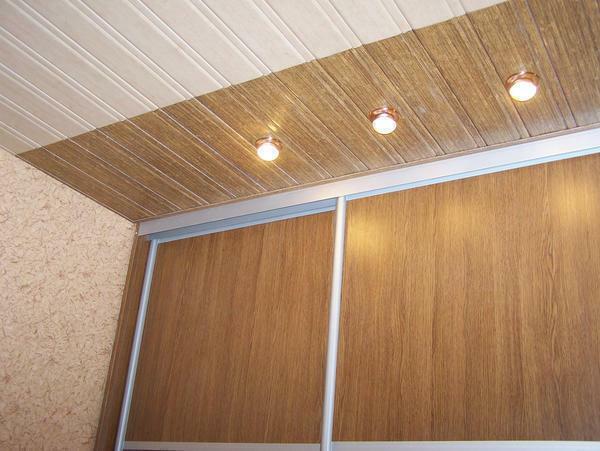 Reechny ceiling with a wooden texture looks great in combination with built-in lights in the classic interior