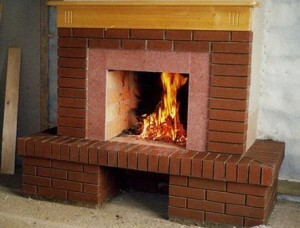 Decorating of fireplace with his hands