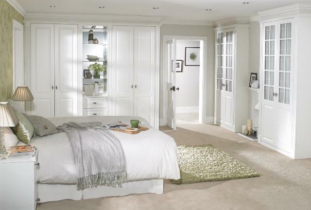 Interior of the bedroom in light colors photo: furniture and design, dark suite, ideas with a small bed, bright accents