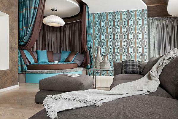 The bedroom, executed in turquoise-brown tones, looks original and stylish