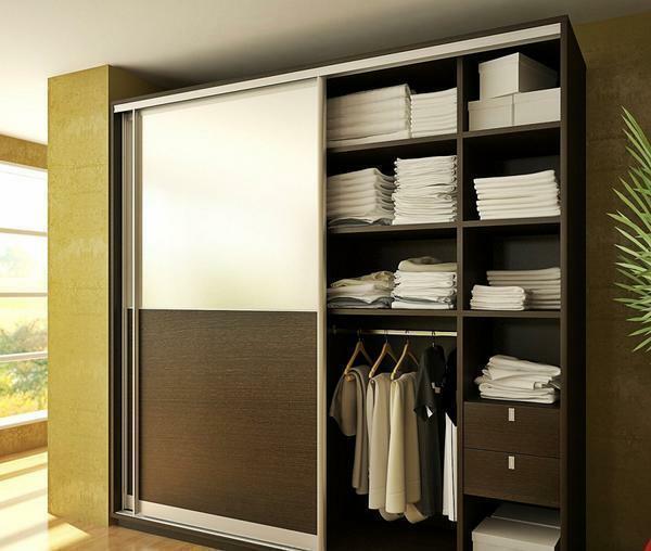 The wardrobe may contain drawers, clothes hangers and storage shelves or towels