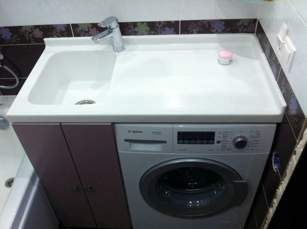Installing the sink over the washing machine is an excellent solution for small bathrooms