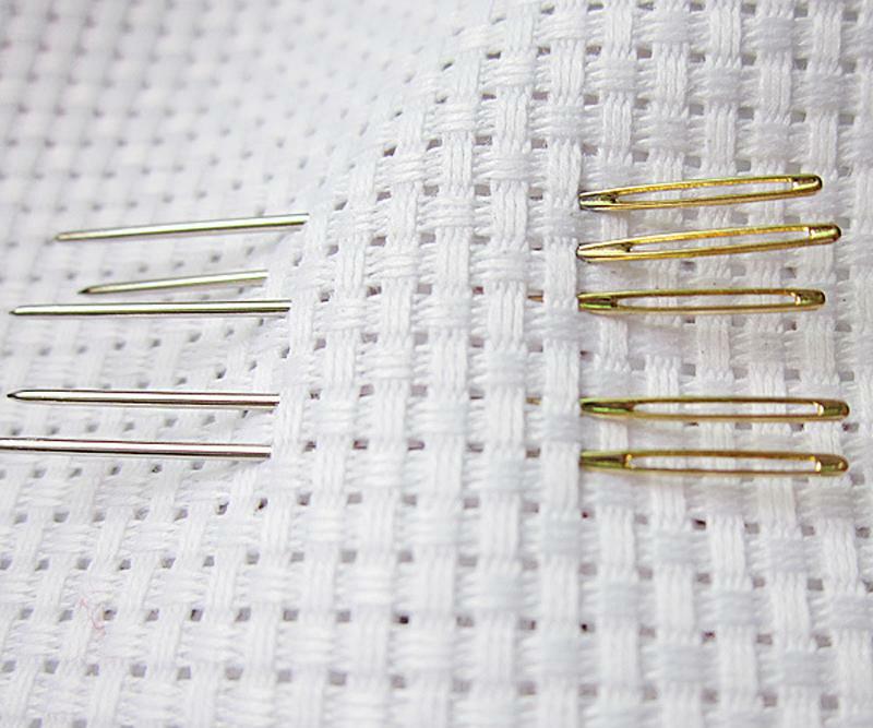 Needles for embroidery are different, and the craftsman chooses needles that are suitable for her kind of embroidery and for the look of her canvas