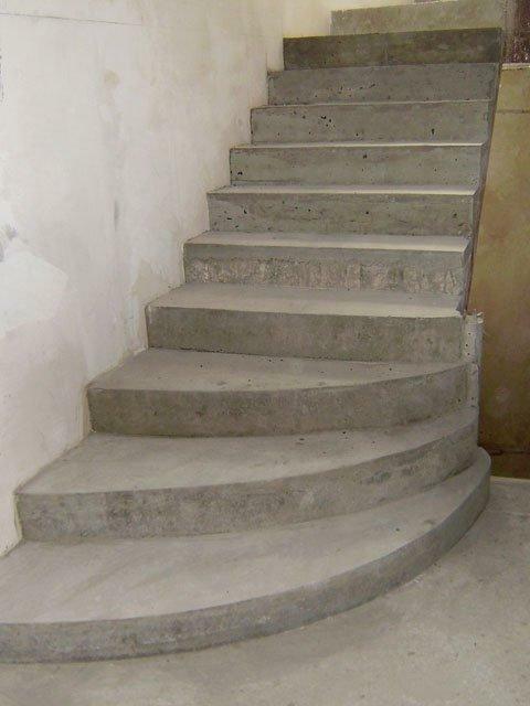 The concrete staircase to the second floor serves as a real home decoration