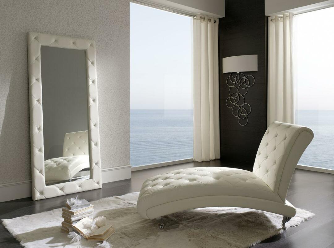 The armchair in the bedroom can be both a decorative and functional interior item