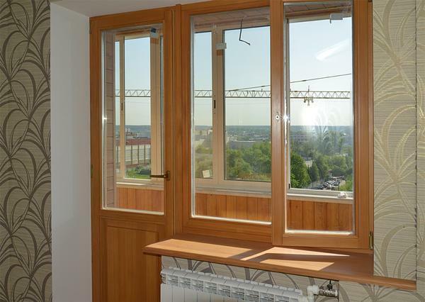 Wooden balcony doors are ecologically and beautifully aesthetic qualities