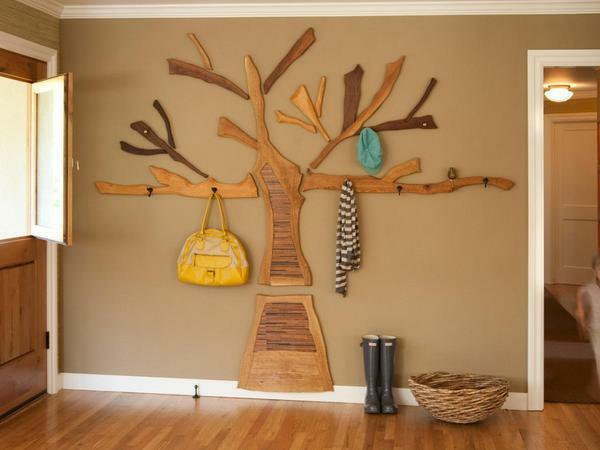 If the room is made in country style, then it will suit a hanger, made in the form of a tree