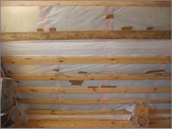Waterproofing of the ceiling and walls in the wooden house is carried out by the following materials: mineral wool, polyethylene film, ruberoid and hydroisol