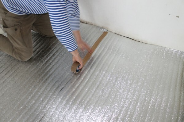 Laying penofol for underfloor heating