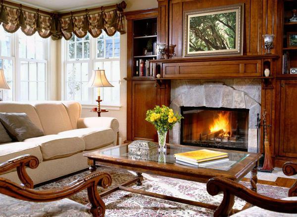 In the classic living room fireplace is recommended to cover with natural stone or decorative brick