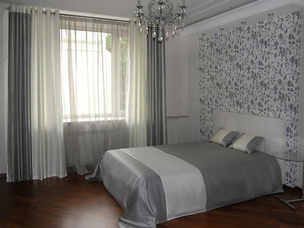 Gray curtains in the bedroom create a sense of elegance and wealth