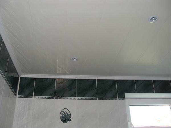 Glossy surface is a good option for decorating the ceiling in a room in which there is not enough space