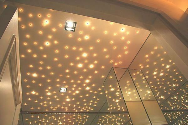 Lighting is the main function of the built-in lamps. Different pendants and curly elements will be superfluous on suspended ceilings